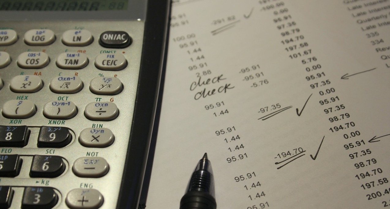 Calculator on top of a printed paper with numbers