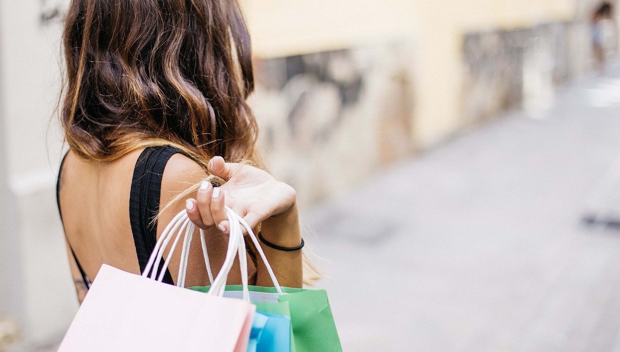 Woman holding multiple shopping bags