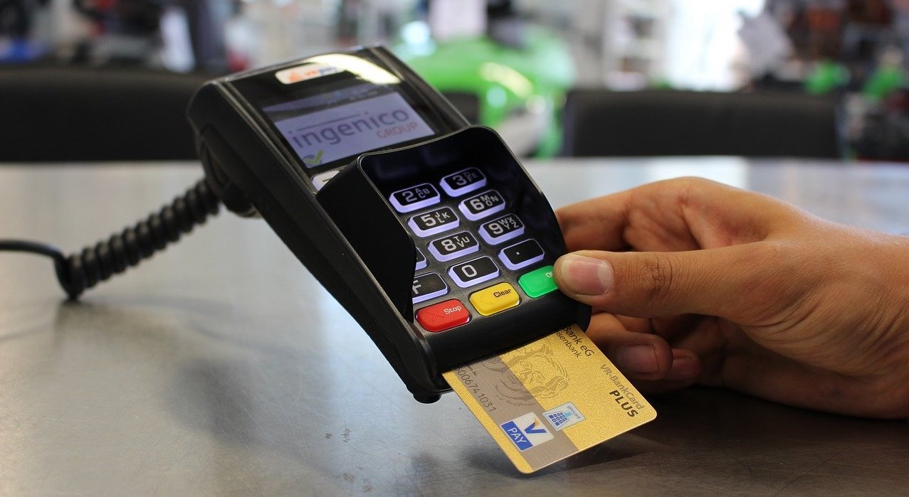 Credit card inserted on a portable payment terminal