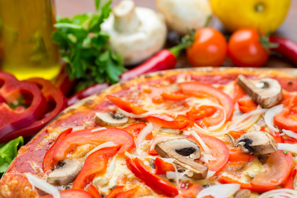 pizza with onion, pepper and mushrooms