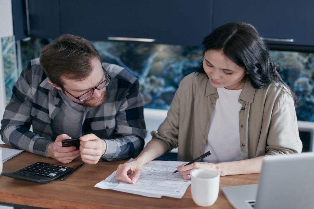 Couple checking their financial report