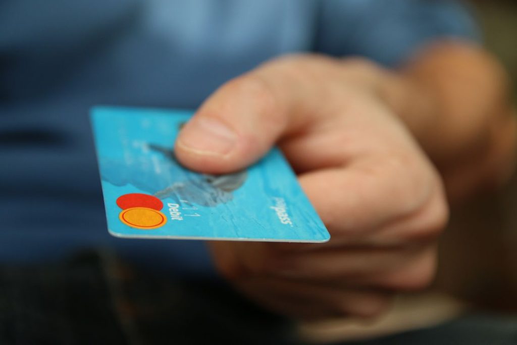 Man handing out a credit card