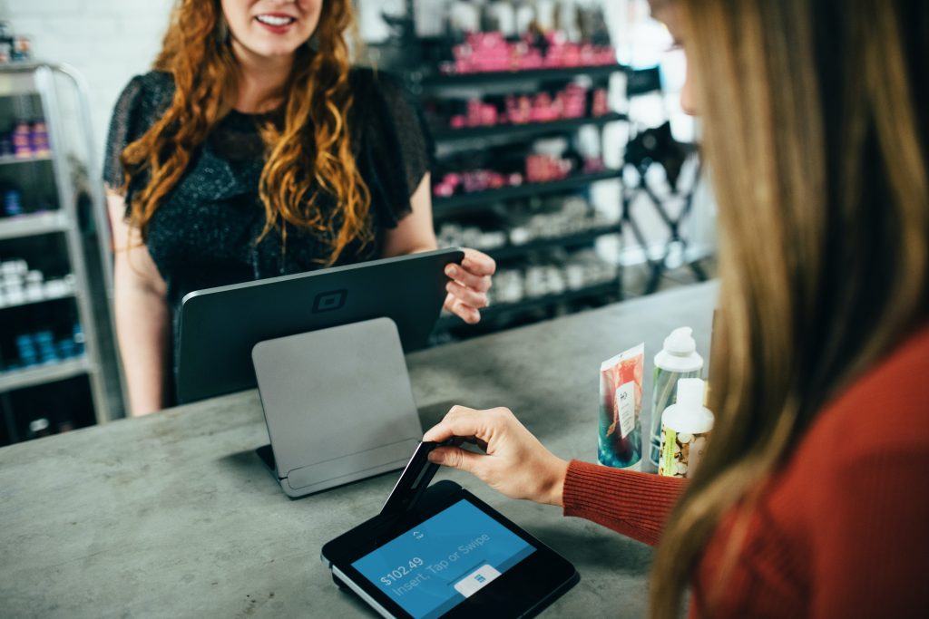 A woman shopping a using her credit card