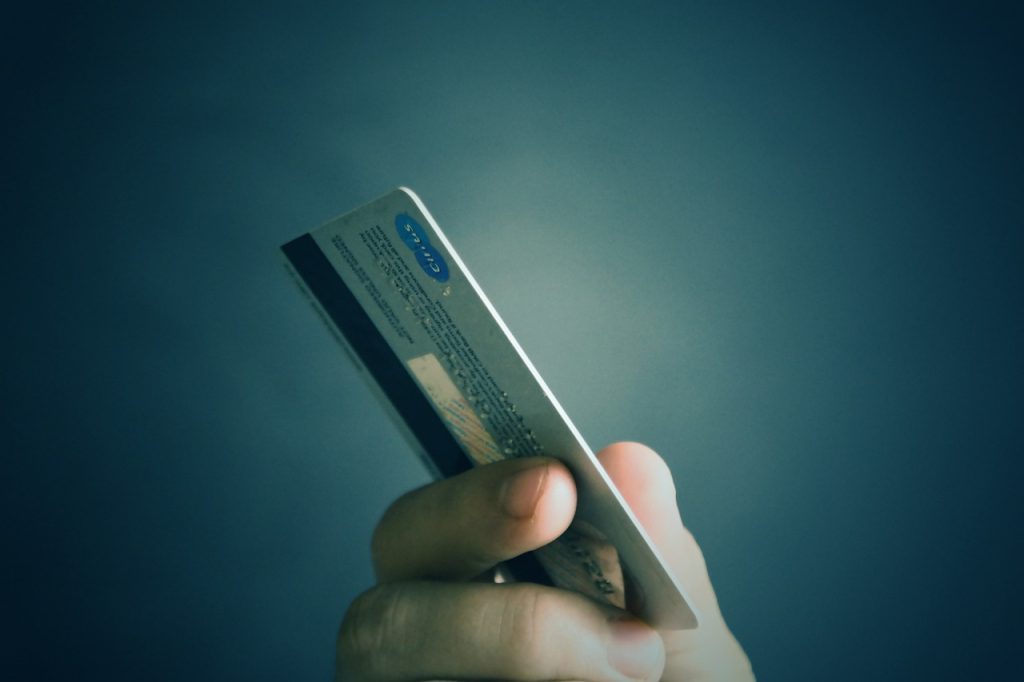 A credit card on a man's hand