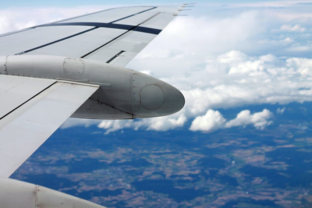 A window view of an airplane's wing