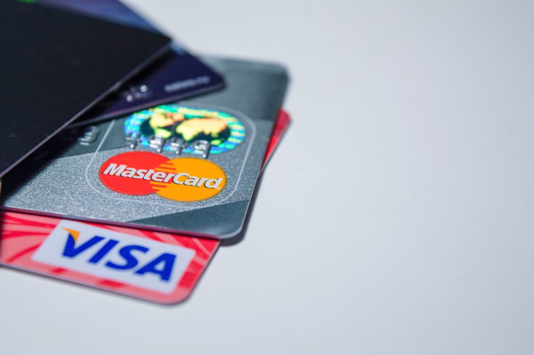 Mastercard and Visa card inserted on the table