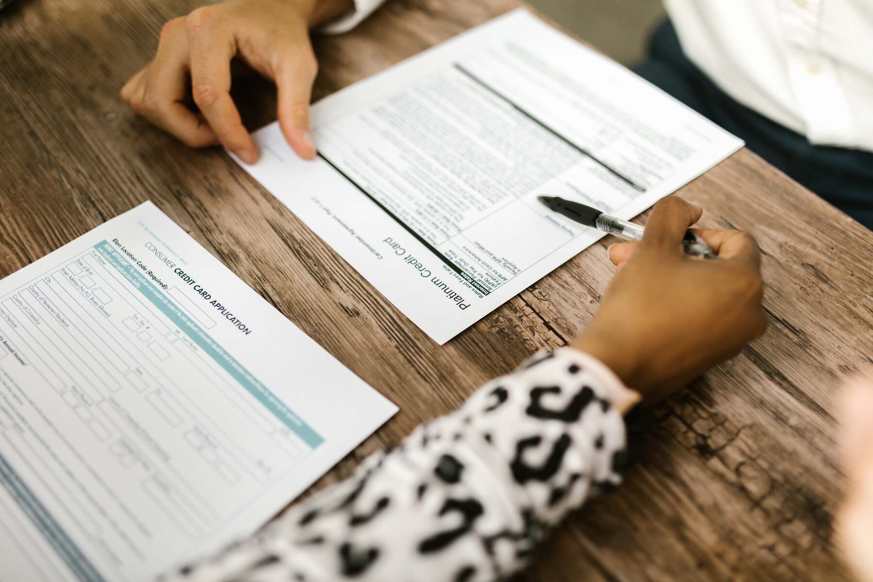 Woman explaining the credit card application requirements to her client