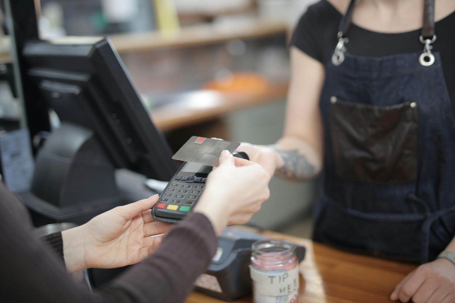 A customer swiping her card on the terminal payment